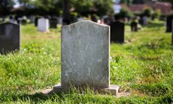 blank-gravestone-with-other-graves-in-the-background-picture-id1006480588.jpg